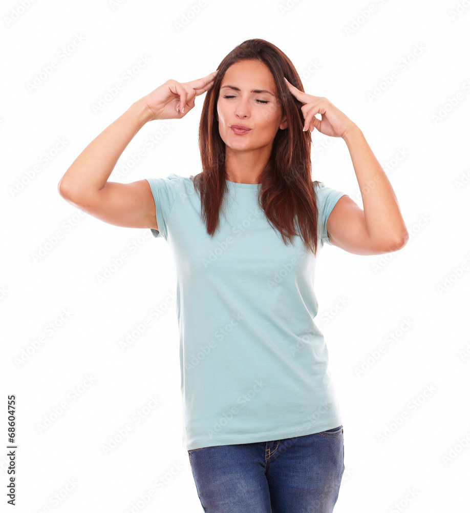 Pensive young lady with eyes closed standing