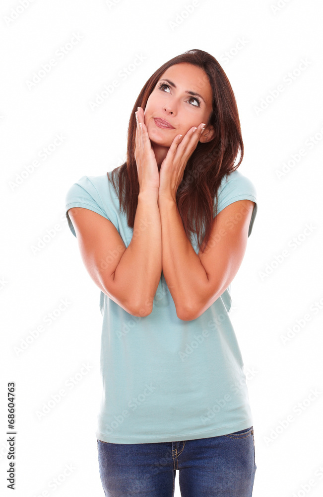 Pensive brunette with her hands on face Pensive brunette with her hands on face