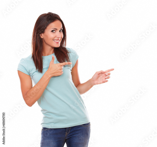 Tableau sur toile Fashionable latin lady pointing to her left