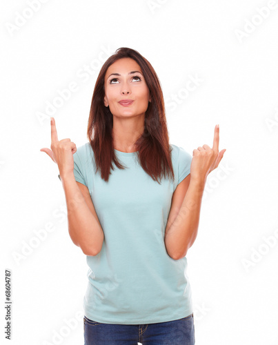 Pretty friendly woman pointing up her fingers