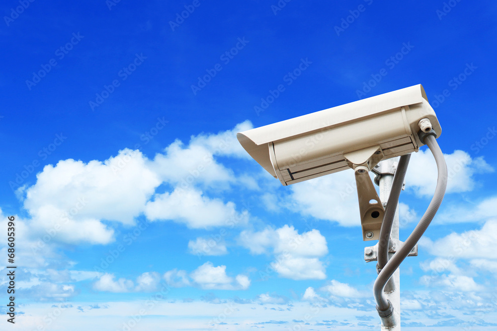 Security camera on blue sky background Security camera on blue sky background