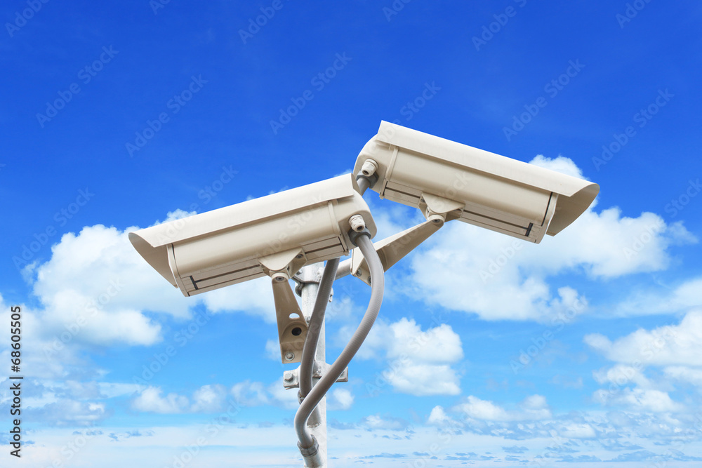 Security camera on blue sky background Security camera on blue sky background