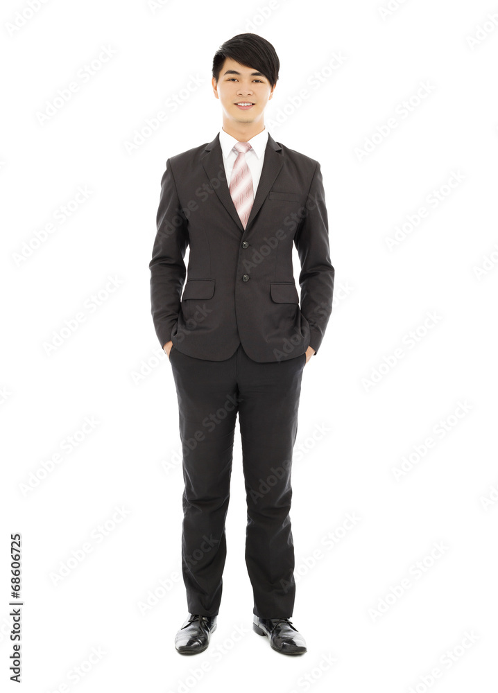 young businessman standing and hands on pocket young businessman standing and hands on pocket