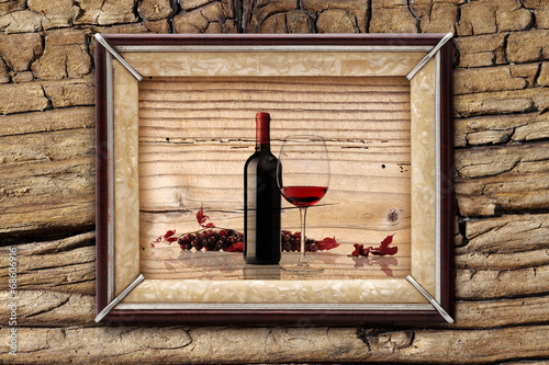 bottle and glass of wine on wooden backgrounds