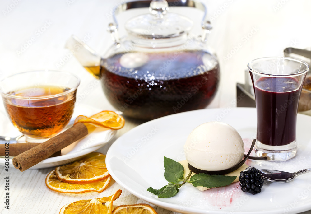 dessert, a piece of cake on the table with a cup of tea