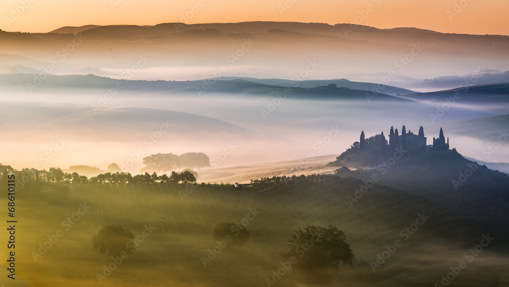 Sunrise over the valley of olive groves and vines