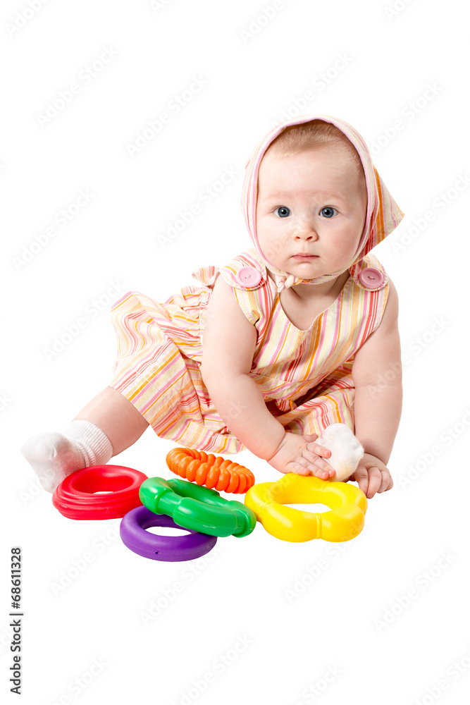 Child girl playing with educational toy color pyramidion Child girl playing with educational toy color pyramidion