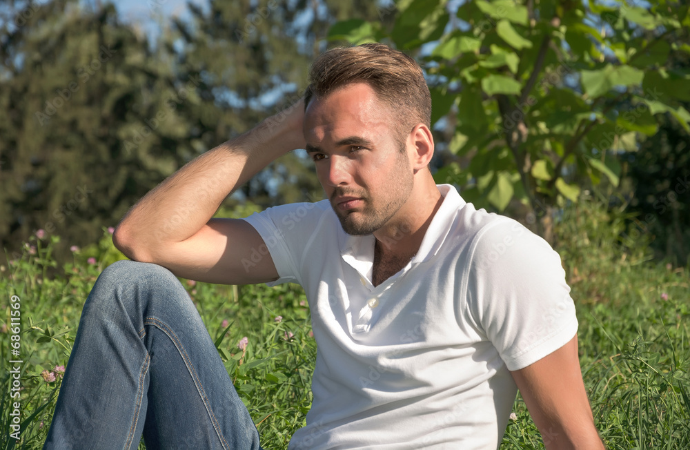 Man resting in a summer park