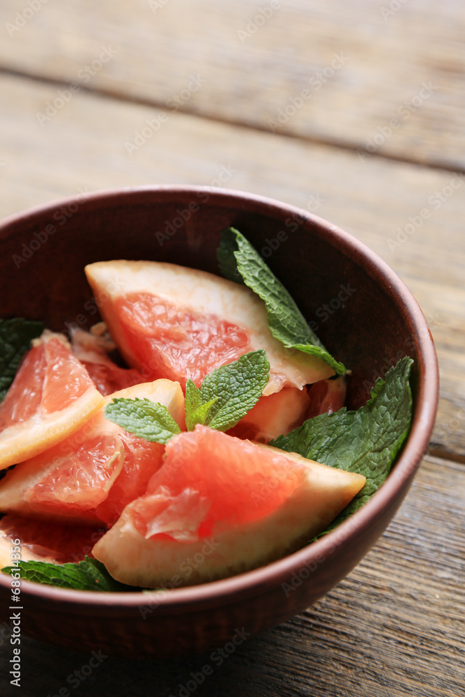 Ripe chopped grapefruit with mint leaves Ripe chopped grapefruit with mint leaves