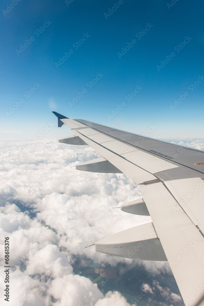 Airplane wing out of window Airplane wing out of window