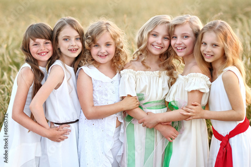 portrait of six little girls in cornfield field
