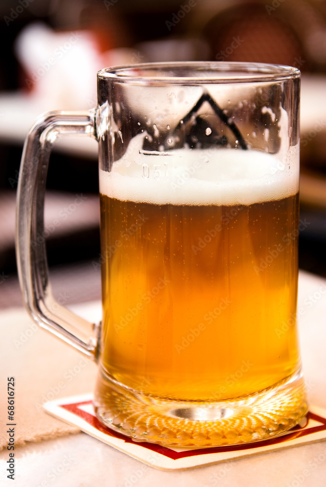 glasses with light and dark beer in a cafe glasses with light and dark beer in a cafe