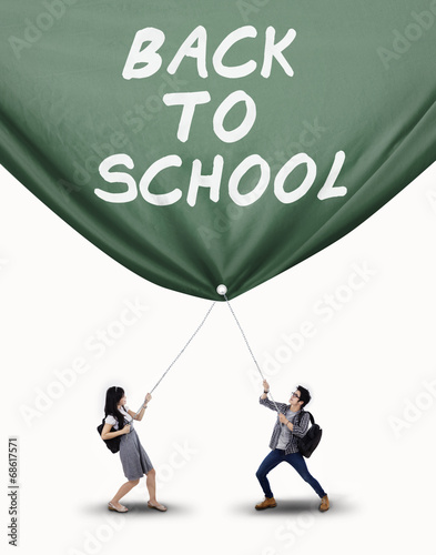 College student pulling a banner isolated
