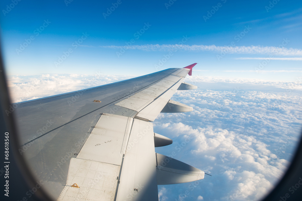Airplane wing out of window Airplane wing out of window