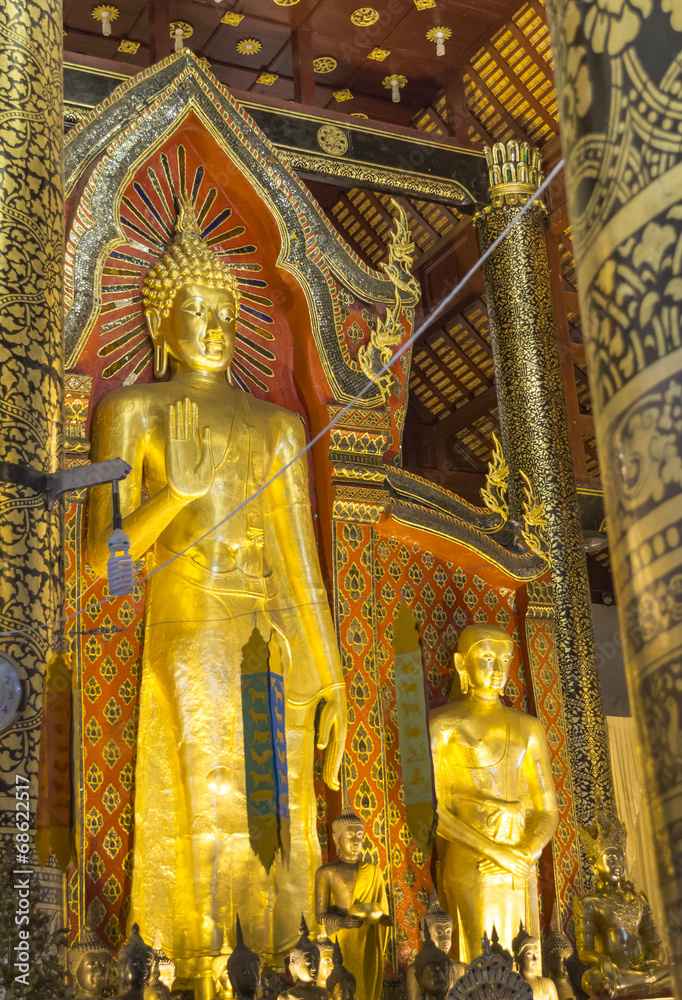 gold Buddha  statue in temple of Thailand.