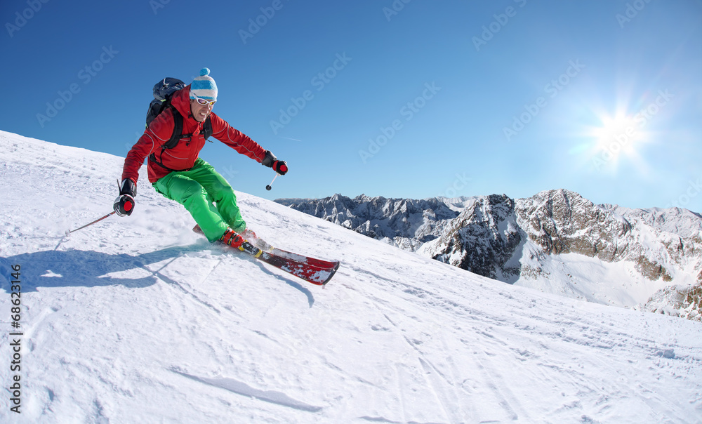 Skier against blue sky in high mountains Skier against blue sky in high mountains