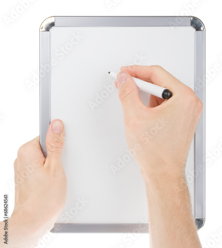 Holding and writing on empty whiteboard isolated on white