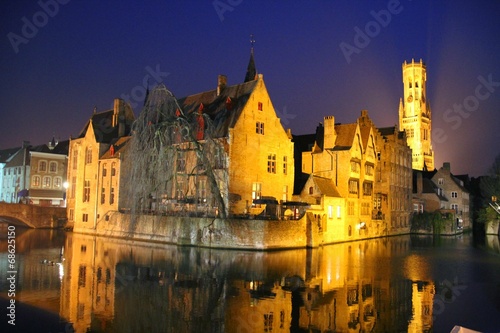 Canal in Bruges with the famous Belfry in the background