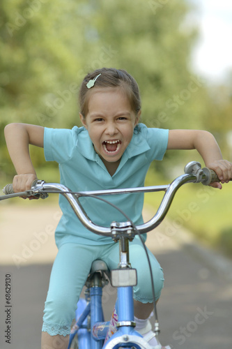 Happy girl on a bicycle