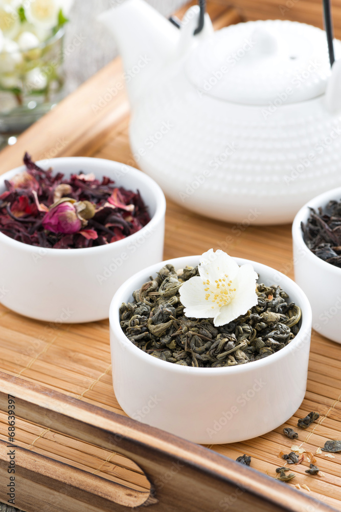 dry herbal teas and kettle of freshly brewed tea dry herbal teas and kettle of freshly brewed tea
