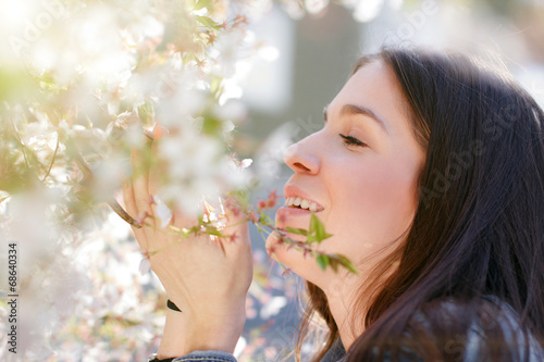Woman smell cherry tree flower