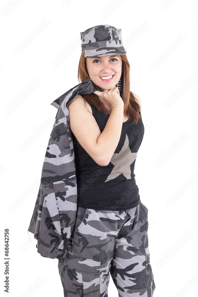 Beautiful young woman posing with gray military uniform Beautiful young woman posing with gray military uniform
