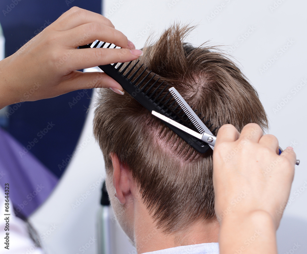 Naklejka premium Young man in beauty salon