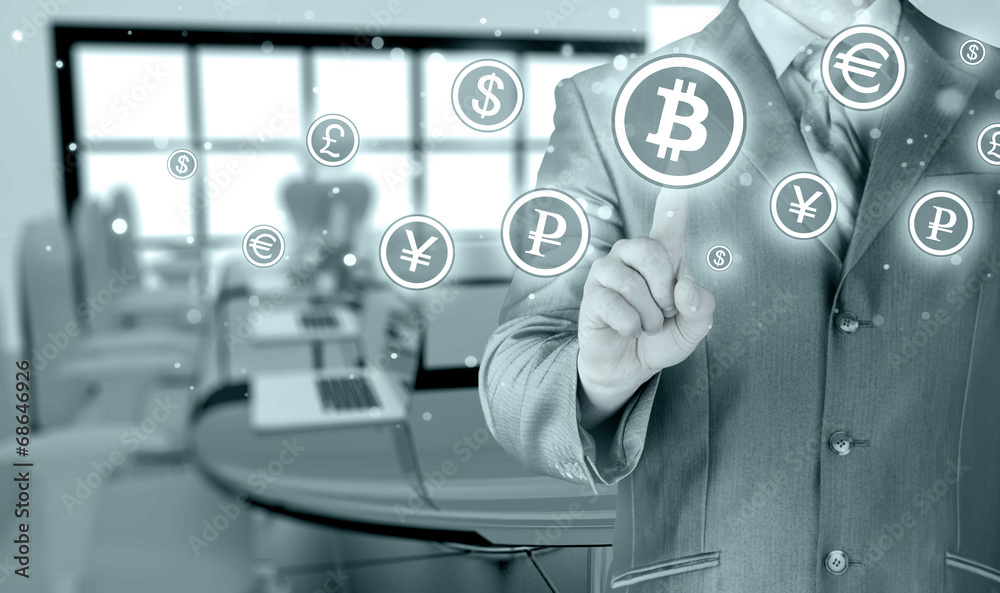 Obraz premium Choosing bitcoins, businessman pressing touch screen button.