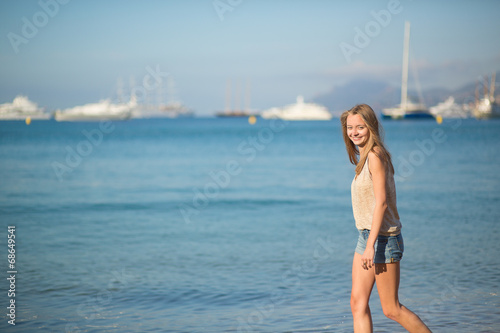 Beautiful girl on the beach in Cannes, France