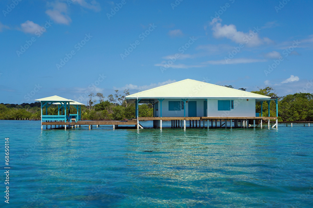 Caribbean house on stilts over water