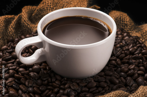 Hot Cup of Coffee With Coffee Beans