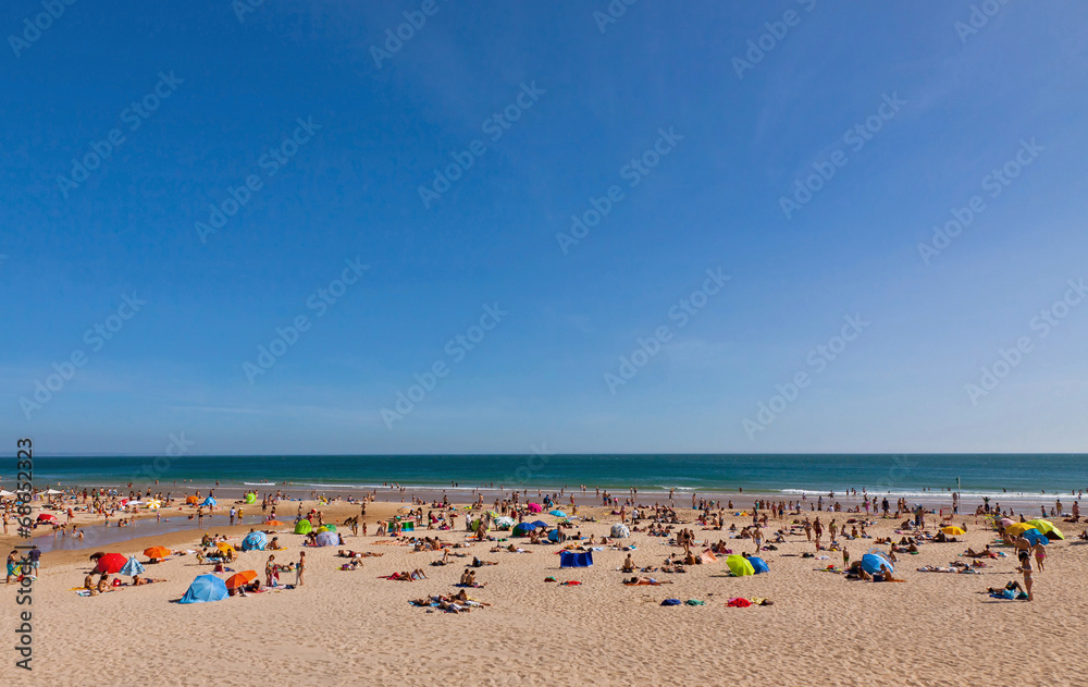 Crowded Atlantic summer beach in Portugal