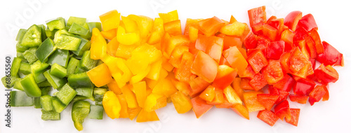 Chopped colorful capsicum over white background 