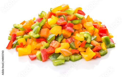 Colorful mix chopped capsicums over white background