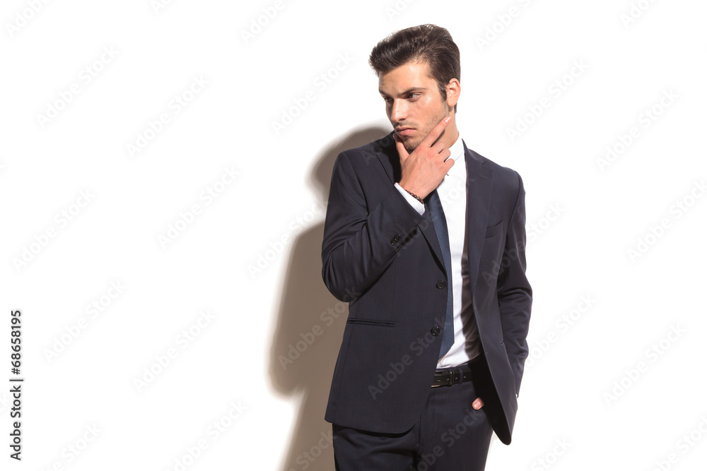 elegant business man thinking and looks away to side elegant business man thinking and looks away to side