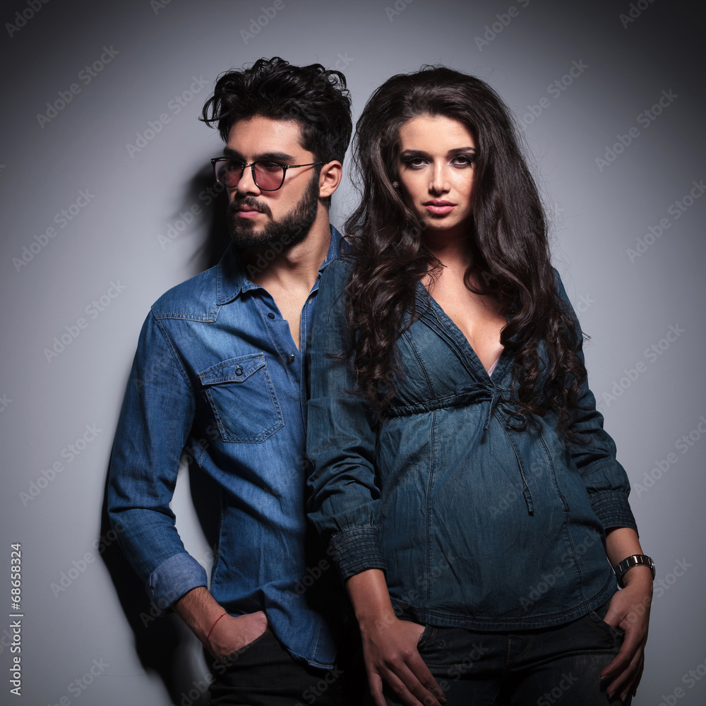man looking to his side near girlfriend man looking to his side near girlfriend