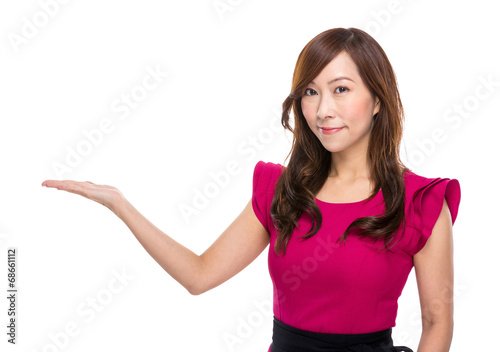 Mature businesswoman with hand presentation