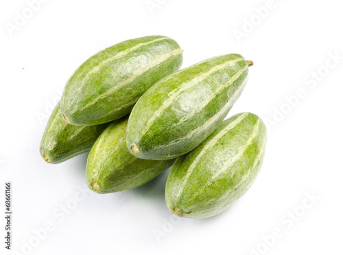 Pointed gourds over white background
