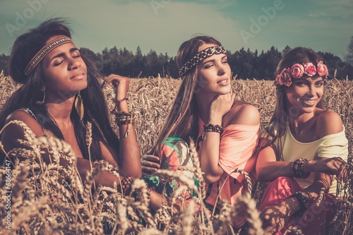 Multi-ethnic hippie girls in a wheat field