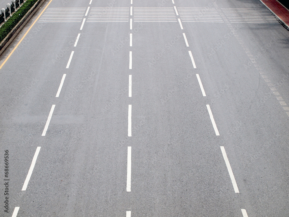 Asphalt road with white stripes