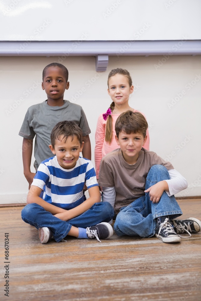 Classmates smiling together in classroom Classmates smiling together in classroom