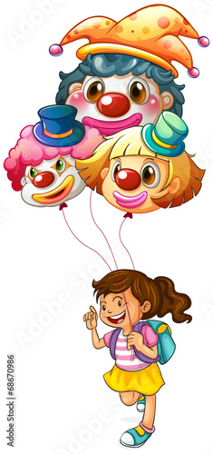 A happy girl holding clown balloons