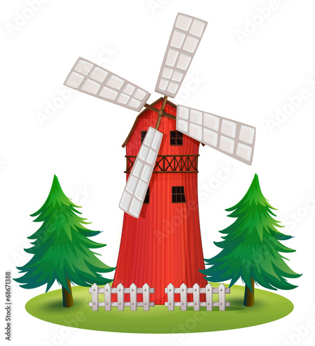 A tall wooden building with a windmill