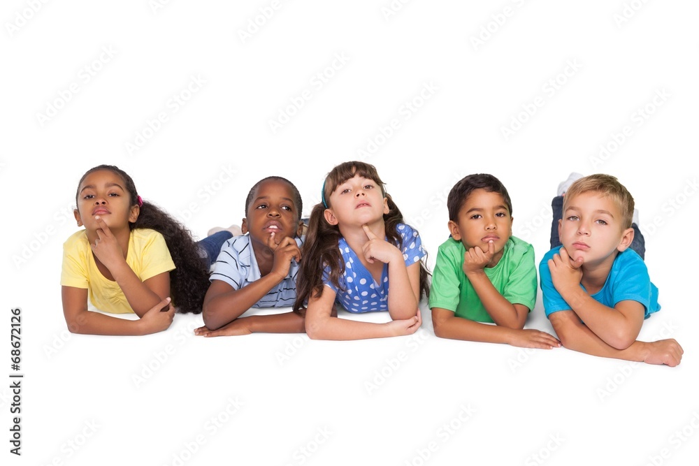 Cute schoolchildren lying and thinking Cute schoolchildren lying and thinking