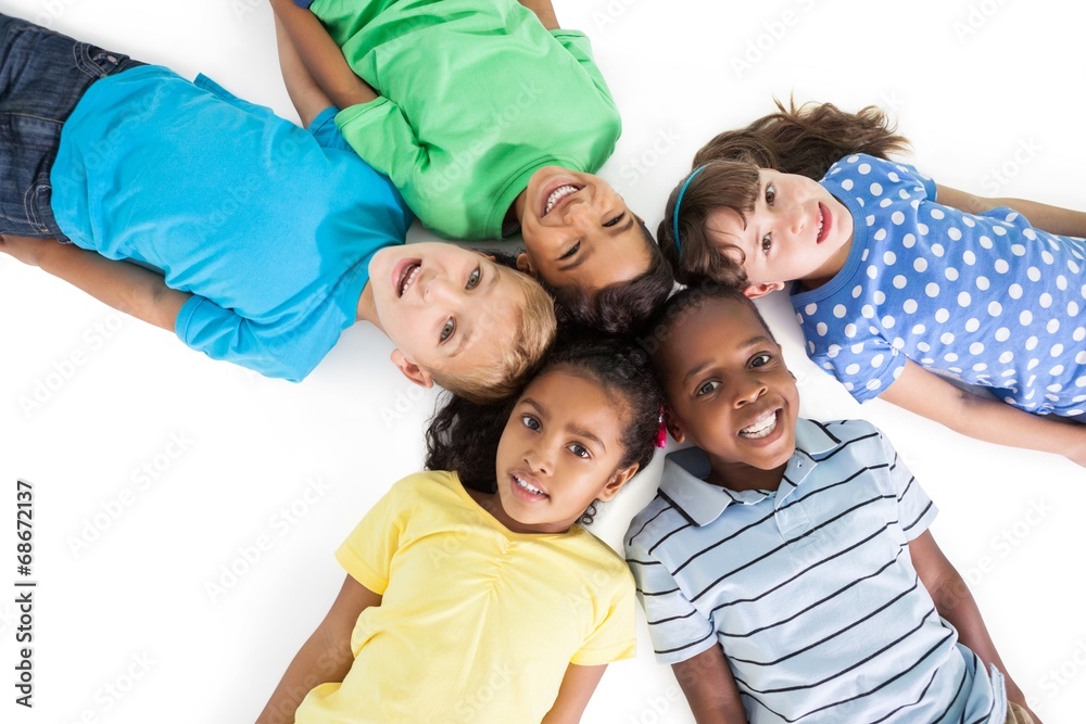 Cute children lying in a circle