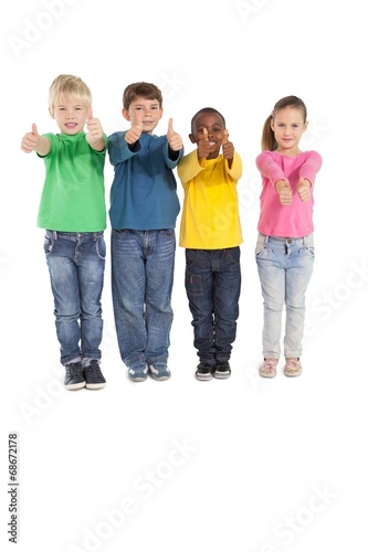 Happy little children showing thumbs up