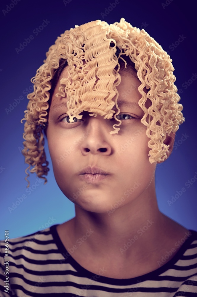 Angry teen girl with macaroni instead hair