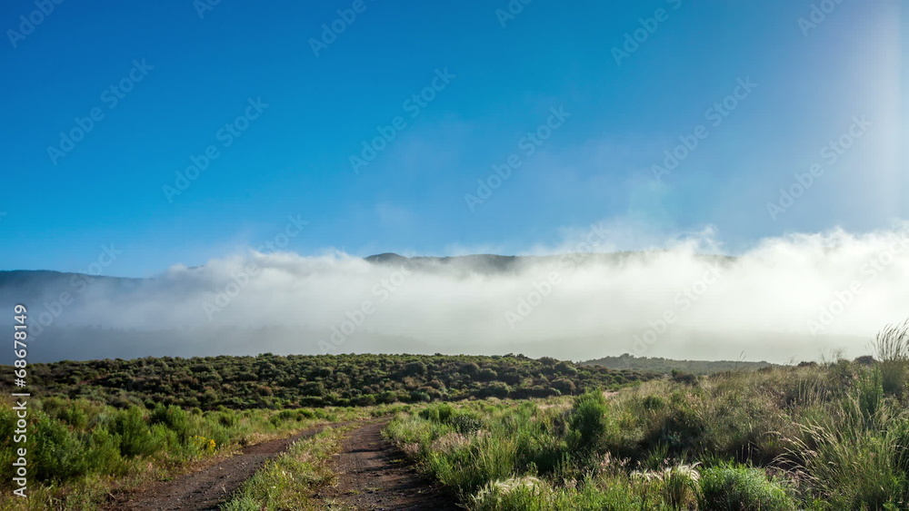 Moving clouds in mountains during sunrise Moving clouds in mountains during sunrise