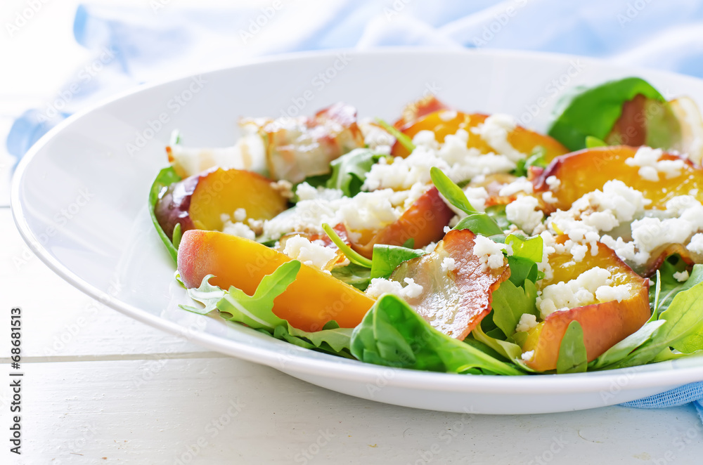 salad with peaches, bacon; arugula, spinach and goat cheese salad with peaches, bacon; arugula, spinach and goat cheese