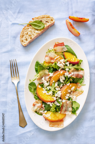 salad with peaches, bacon; arugula, spinach and goat cheese